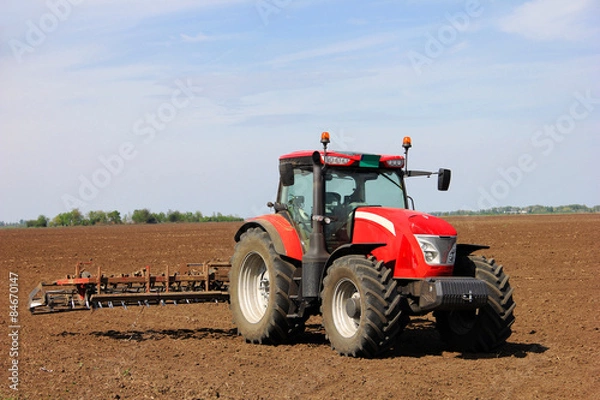 Obraz Tractor on a farmland