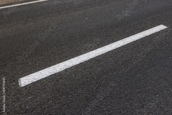 Fototapeta details of road markings on the road for traffic control