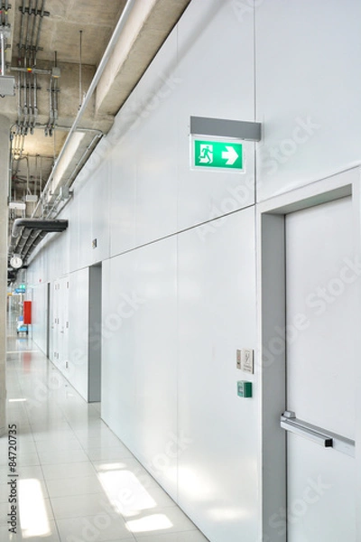 Fototapeta Fire exit sign in factory