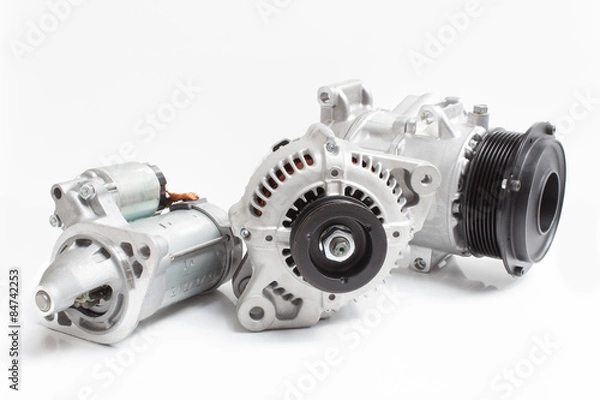 Fototapeta photos on the composition of the three parts for the engine. Generator, air conditioning compressor and the starter on a gray background