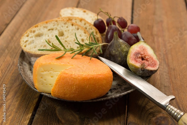 Fototapeta snack of french cheese with figs and grapes