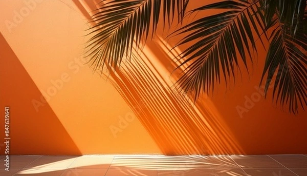 Obraz ヤシの葉と影がオレンジ色の壁に映る背景素材