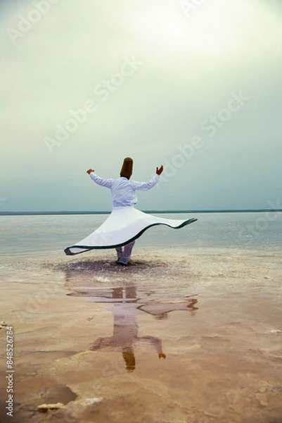 Fototapeta Sunset and whirling at the sea, sufi. sufi whirling (Turkish: Semazen) is a form of Sama or physically active meditation which originated among Sufis.