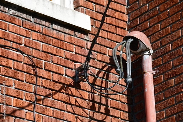 Obraz Weatherhead on brick building, electrical hookup.