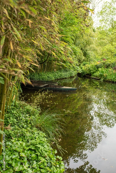 Fototapeta Water garden setting at Famous Artist's Home in Giverny France with Boat