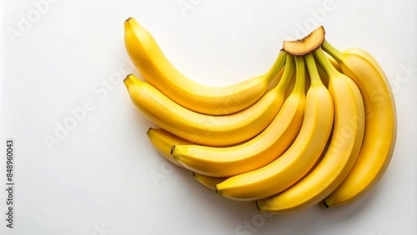 Fototapeta Vibrant yellow bananas arranged in a curved pattern, slight peeling at the tips, with a subtle creamy tone, against a clean white background with ample copyspace.