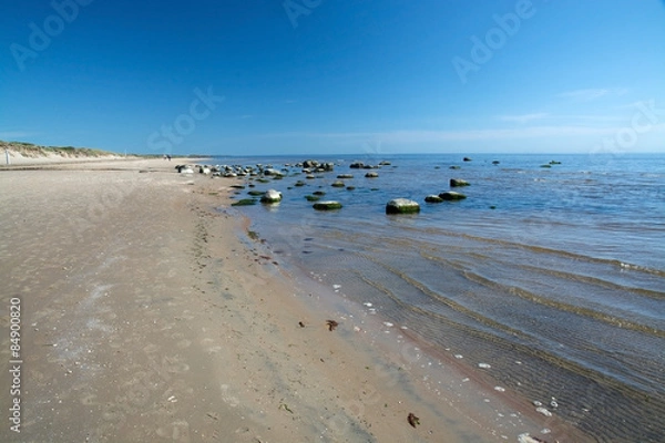 Obraz Sandy beach landscape with small rocks in Falkenberg, Sweden.