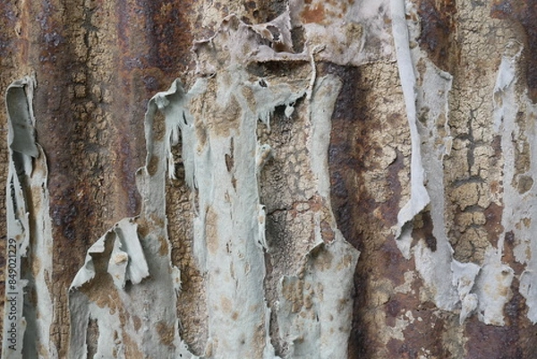 Fototapeta Close-up of texture with rusty metal and tattered linen, unique and artistic abstract background