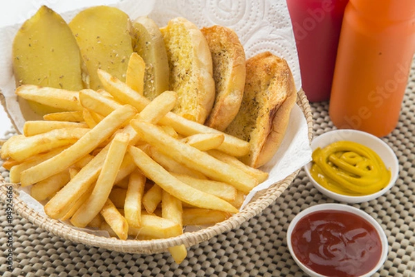 Fototapeta Traditional French fries with ketchup and bread