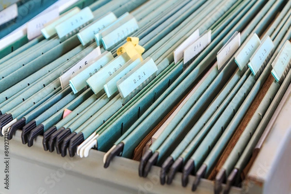 Fototapeta File folders in a filing cabinet