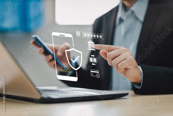 Fototapeta Concept of cyber crime and cyber security. Hand using laptop and smartphone for internet banking money transaction with two-step verification,  authentication, information security and encryption.