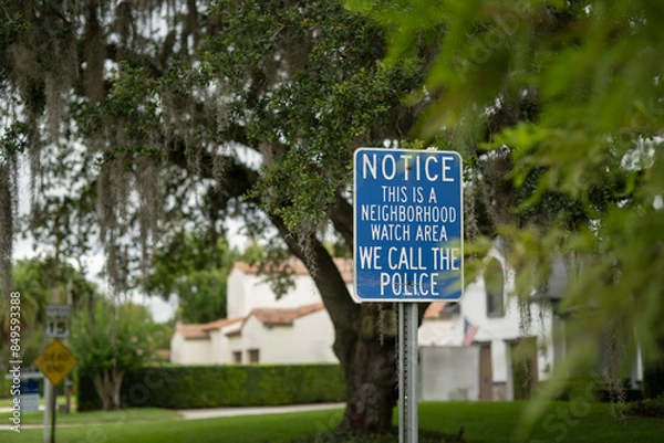 Obraz Close-up NOTICE THIS IS A NEIGHBOURHOOD WATCH AREA WE CALL THE POLICE on a  wood lined street, room for copy