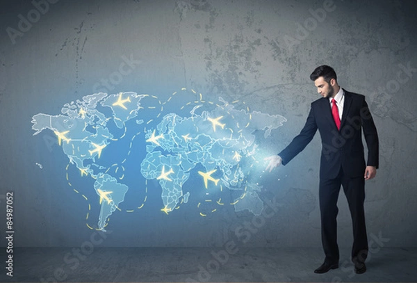 Fototapeta Business person showing digital map with planes around the world