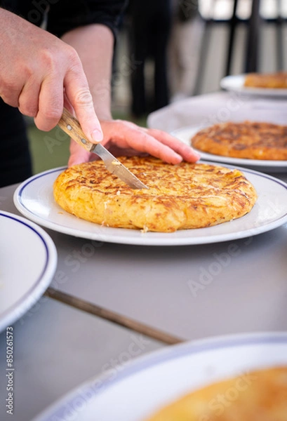 Obraz Slicing Spanish Omelette for Serving