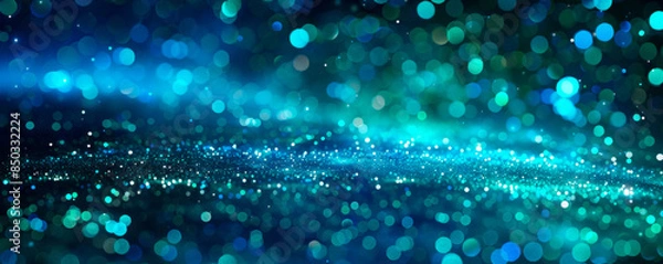 Fototapeta Swirls particles of indigo and emerald lights intertwine in a mesmerizing display, creating a dreamy and enchanting atmosphere. Background for the presentation. Banner. Copy space