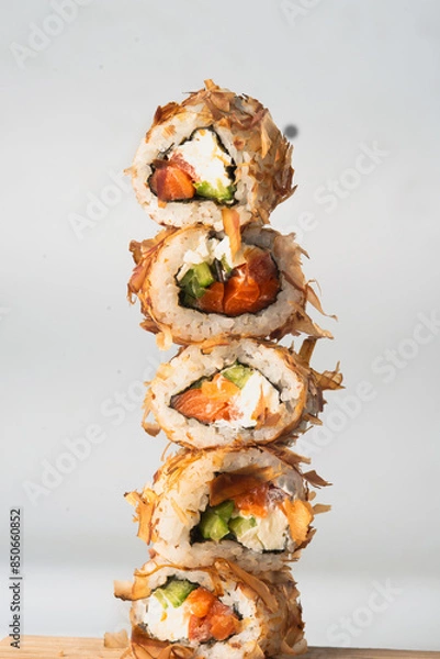 Fototapeta Pyramid of sushi rolls with tuna shavings
