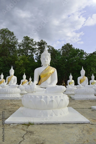 Fototapeta The white Buddha statue was created by a devotee for a Buddhist temple.Thailand, Khemmarat, Ubon ratchathani