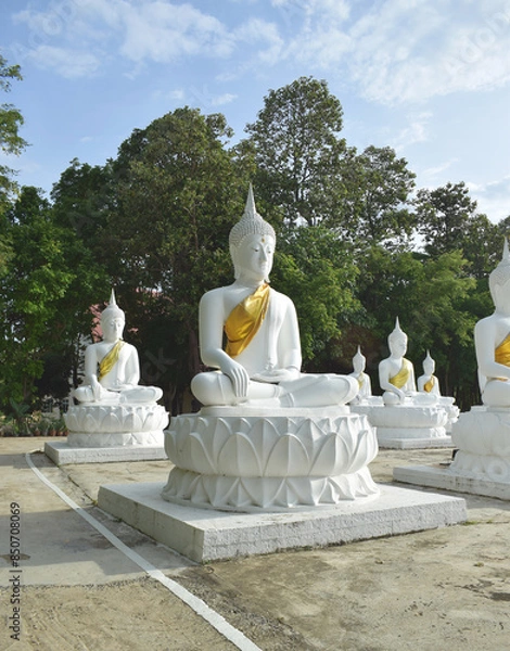 Fototapeta The white Buddha statue was created by a devotee for a Buddhist temple.Thailand, Khemmarat, Ubon ratchathani