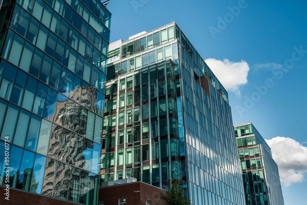 Fototapeta Contemporary glass-paneled office space in Moncton, New Brunswick, embodying innovation and progress with bright, inviting reflections.