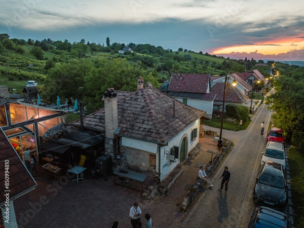 Fototapeta Hungary - Etyek at sunset time from drone view