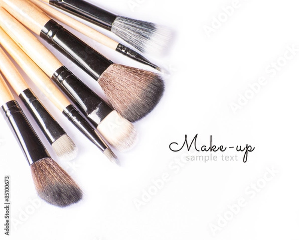 Obraz Makeup brushes on white background with sample text