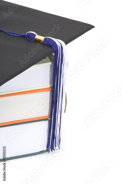 Fototapeta graduation cap and books