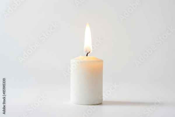 Fototapeta Single Burning Candle on a White Background