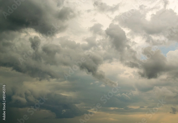 Obraz Fluffy Rain Clouds Against Cloud Filled Sky