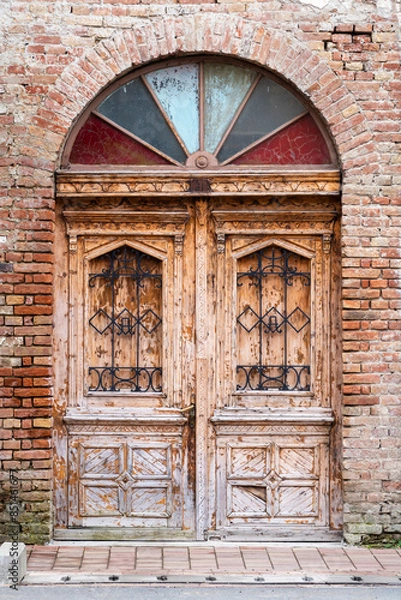 Fototapeta A view of an old door of a church