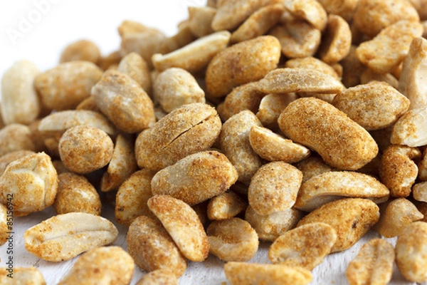 Fototapeta Spicy dry roasted peanuts detail in perspective.