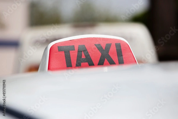 Obraz Red and black taxi sign on car close-up