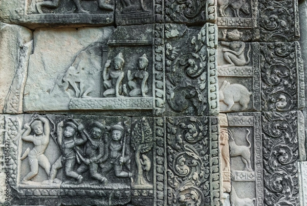 Fototapeta bas-reliefs of decorative panels of the baphuon in the archaeological angkor thom place in siam reap, cambodia