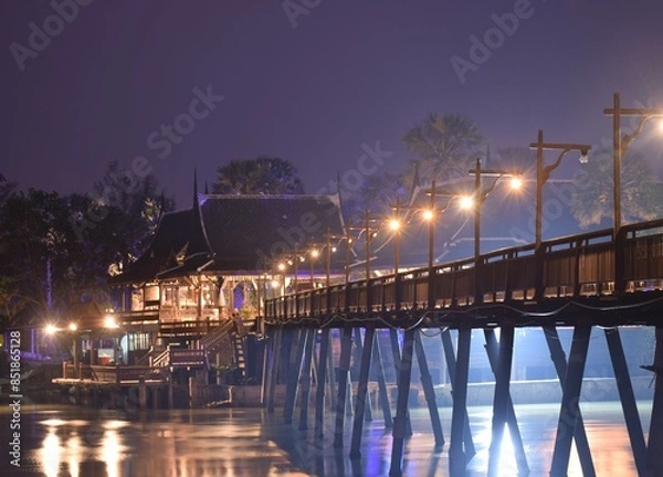 Fototapeta Thai pavillion and bridge  cross the canal  at night.decorate  with  the light