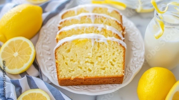 Fototapeta Sliced Lemon Loaf Cake With Glaze and Zest