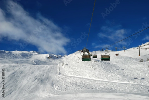 Fototapeta Ski lift on mountains background