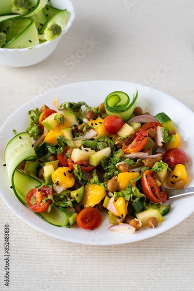 Obraz salad with vegetables on a table