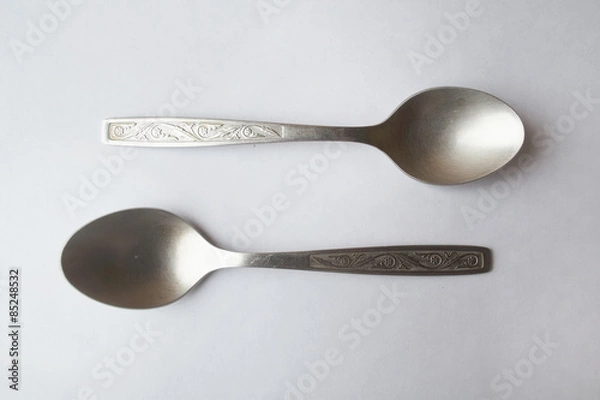 Obraz Two spoons on white background