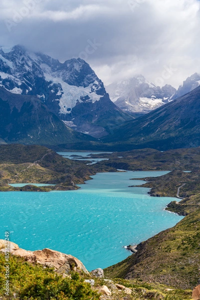 Obraz Lago Pehoe with Nordenskjöld Lake and Paine River in the shadow of Cerro Paine Grande on a partly cloudy day