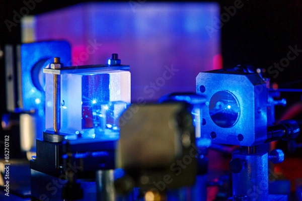 Fototapeta Blue laser in a quantum optics lab.