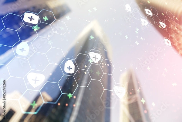 Fototapeta Double exposure of abstract virtual medical hologram on modern skyscrapers background. Healthcare technolody concept