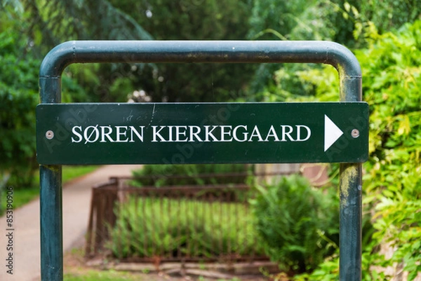 Fototapeta Sign with direction to the grave of Soren Kierkegaard in the cemetery in Kopenhagen, Denmark