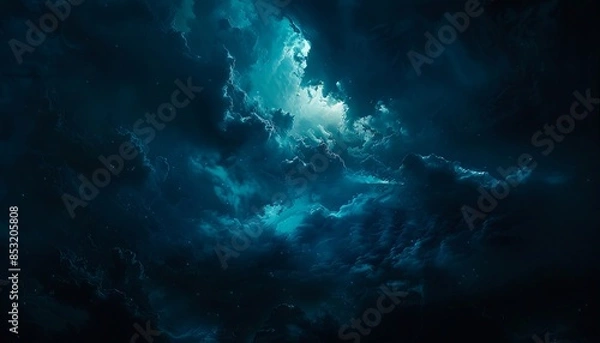 Obraz A dark cloudy sky with a bright light.