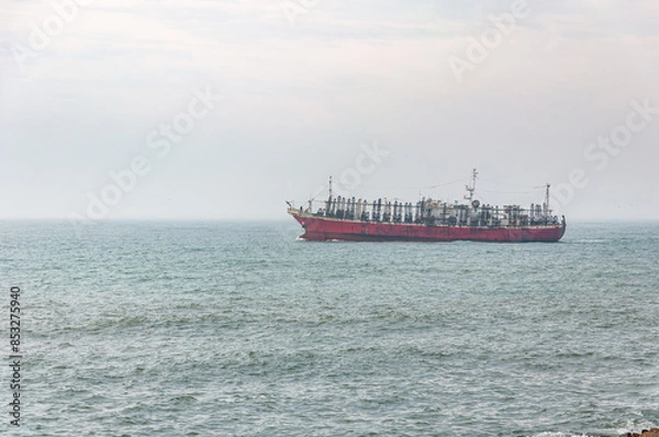 Fototapeta A squid fishing boat sailing off the coast of Mar del Plata, Argentina	