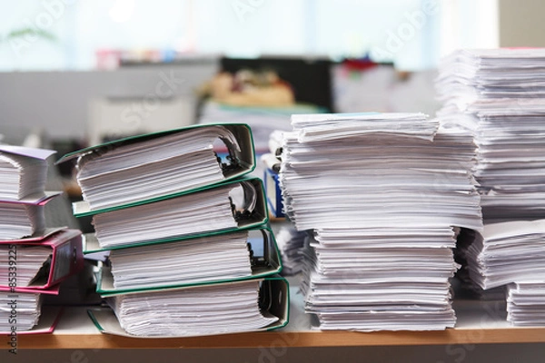 Fototapeta Close up stack of paper on the office desk
