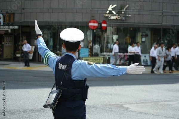 Obraz 交通整理をする警察官 後ろ姿