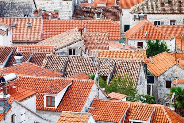 Fototapeta Red tiled rooftops in old town