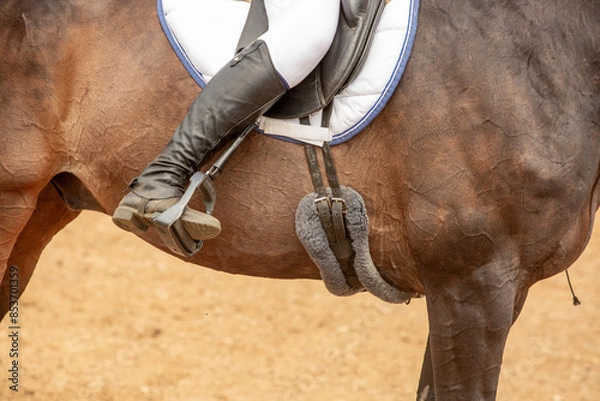 Obraz a rider's leg in boots, a man on a horse