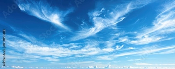 Obraz Beautiful clear blue sky with wispy white clouds making a serene and tranquil scene, perfect for backgrounds and nature-themed projects.