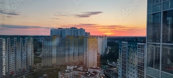 Fototapeta Urban Cityscape featuring High Rise Buildings at Sunset with Beautiful Reflections