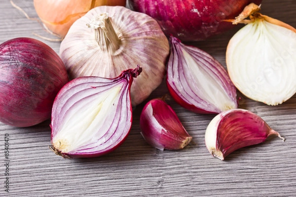 Obraz Artistic onion and garlic on wooden table.